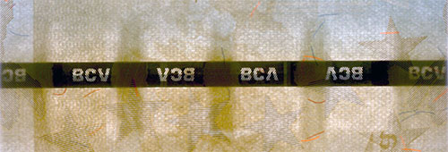 Piece bbcv1000000bss-ab01-a8 (Obverse, partial, in front of light)